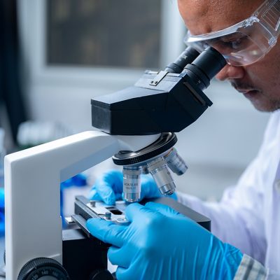 Science and medicine, scientist analyzing and dropping a sample into a glassware, experiments containing chemical liquid in laboratory on glassware, DNA structure, innovative and technology.